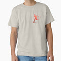 A soccer player skilfully dribbles the football across the playground_Red paint_Side view Classic T-Shirt for Sale by Aariq